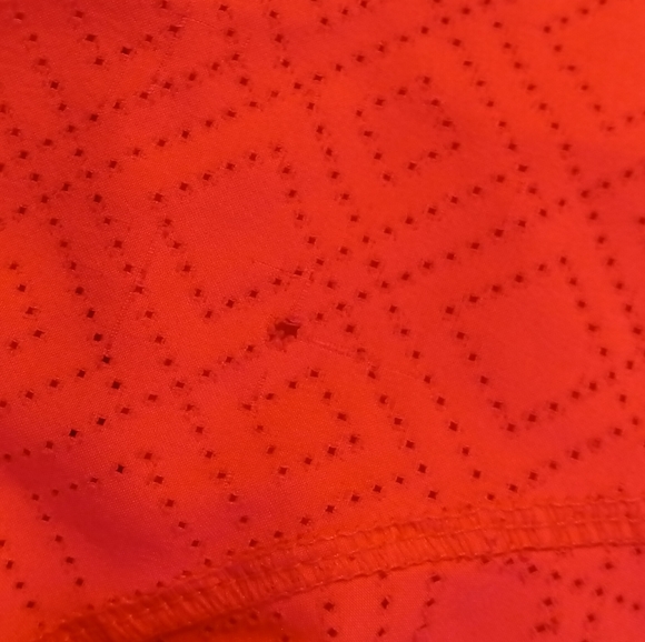 Heat Gear semi fitted size XS coral with orange line on the side - Picture 4 of 4